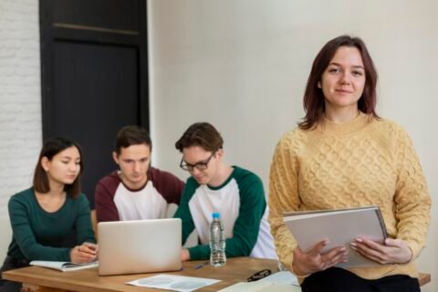 young-student-group-study-posing-desk